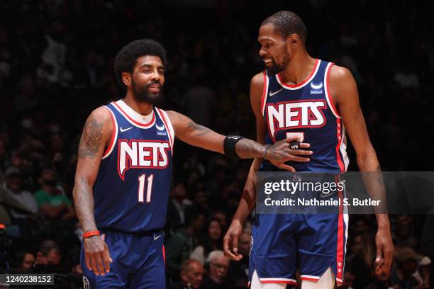 Kyrie Irving talks to Kevin Durant of the Brooklyn Nets during Round 1 Game 4 of the 2022 NBA Playoffs on April 25, 2022 at Barclays Center in...