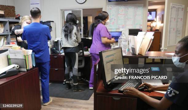 Employees work at the Hope Medical Group for Women in Shreveport, Louisiana, April 19, 2022. - On September 1 one of the most restrictive...