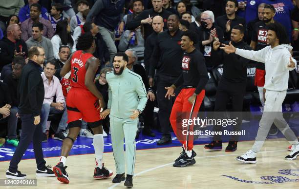 Toronto Raptors guard Fred VanVleet celebrates with Toronto Raptors forward OG Anunoby during a time out as Toronto Raptors start to put the game out...