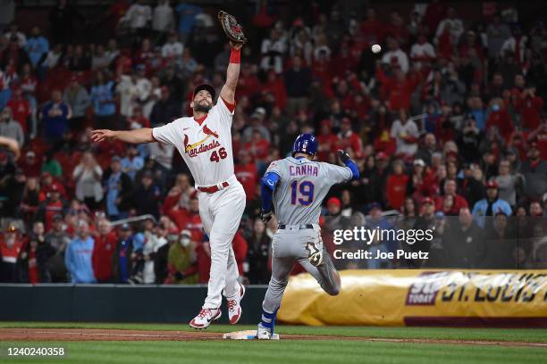 Paul Goldschmidt of the St. Louis Cardinals attempts to catch a wild ball to force out Mark Canha of the New York Mets during the ninth inning at...