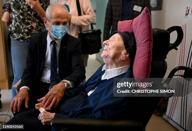 Toulon's mayor Hubert Falco speaks with 118 year-old French catholic nun Lucile Randon at the Saint-Catherine-Laboure nursing home where she lives in...