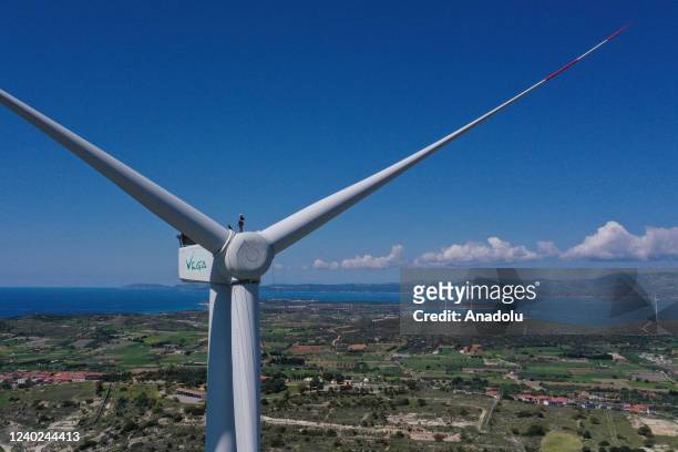 Hazel Kaya, an adrenaline junkie, climbs a wind turbine in Turkiye's Izmir on April 20, 2022. Despite her phobia of heights, Hazel Kaya, an...