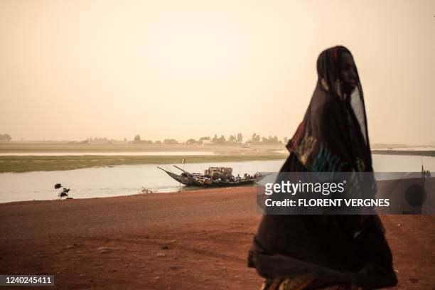 Boat sails along the Niger River in Mopti on March 13, 2022.