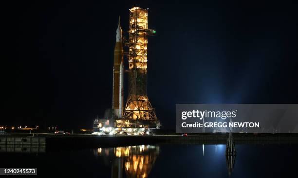 The Artemis I rocket is ferried atop its mobile launch platform back to the Vehicle Assembly Building at the Kennedy Space Center in Florida on April...