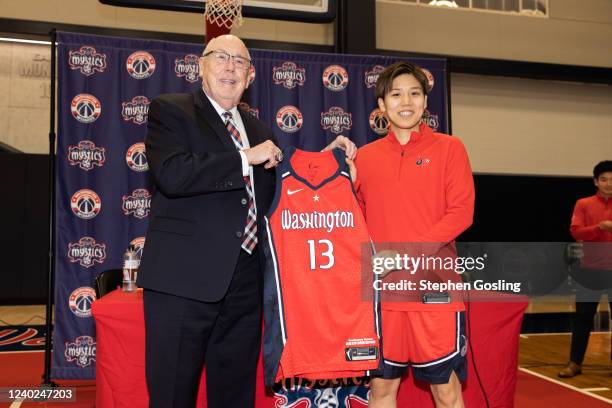 Mike Thibault and Rui Machida hold up the Washington Mystics jersey during an introductory press conference on April 25, 2022 at Entertainment and...