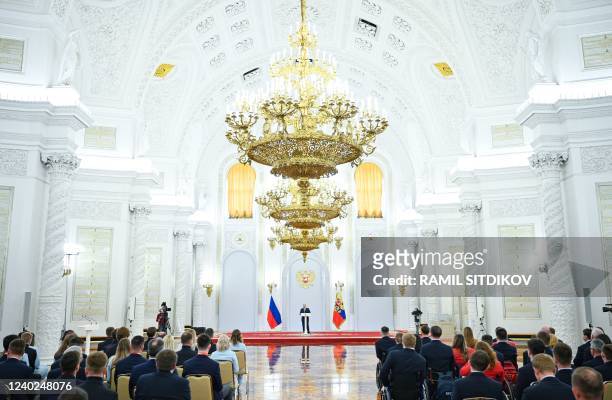 Russian President Vladimir Putin gives a speech as he hosts Russia's medal-winning athletes of the Beijing 2022 Winter Olympic Games and members of...