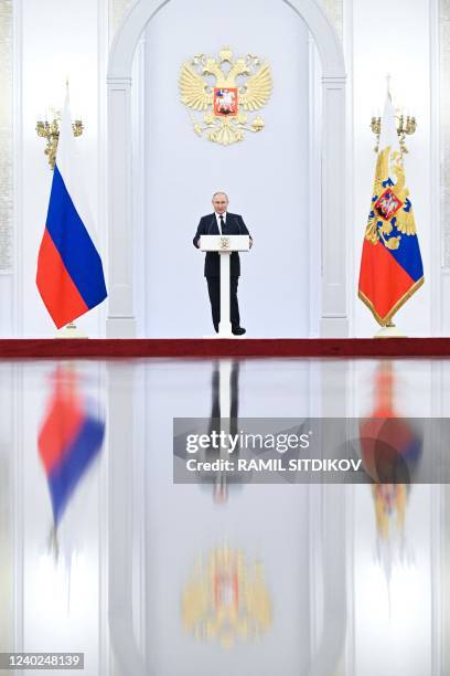 Russian President Vladimir Putin gives a speech as he hosts Russia's medal-winning athletes of the Beijing 2022 Winter Olympic Games and members of...