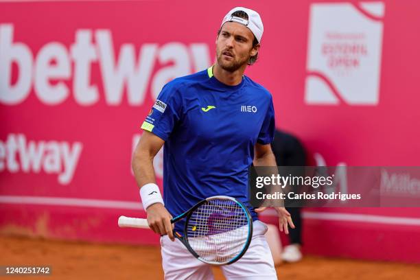 Joao Sousa from Portugal competes against Sebastien Baez from Argentina during Millennium Estoril Open ATP 250 tennis tournament, at the Clube de...