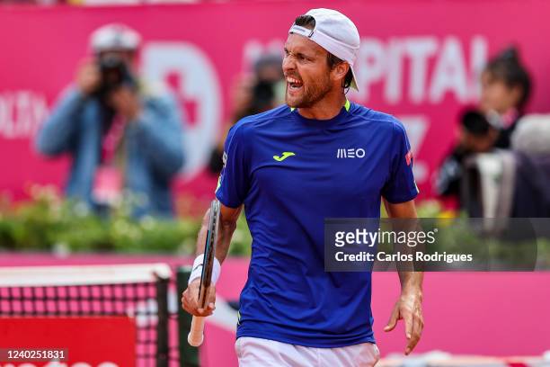 Joao Sousa from Portugal reacts while competes against Sebastien Baez from Argentina during Millennium Estoril Open ATP 250 tennis tournament, at the...