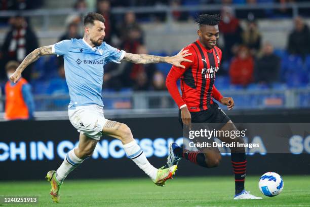 Francesco Acerbi of SS Lazio and Rafael Leao of AC Milan battle for the ball during the Serie A match between SS Lazio and AC Milan at Stadio...