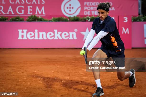 Pierre Hugues Herbert from France competes against Sebastien Korda from the United States during Millennium Estoril Open ATP 250 tennis tournament,...