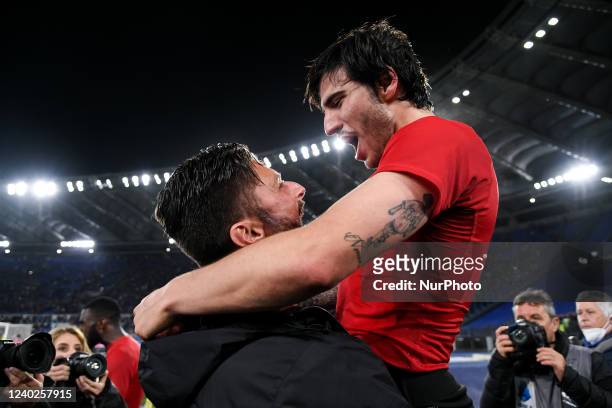 Olivier Giroud of AC Milan celebrates the victory with Sandro Tonali of AC Milan during the Serie A match between SS Lazio and AC Milan at Stadio...