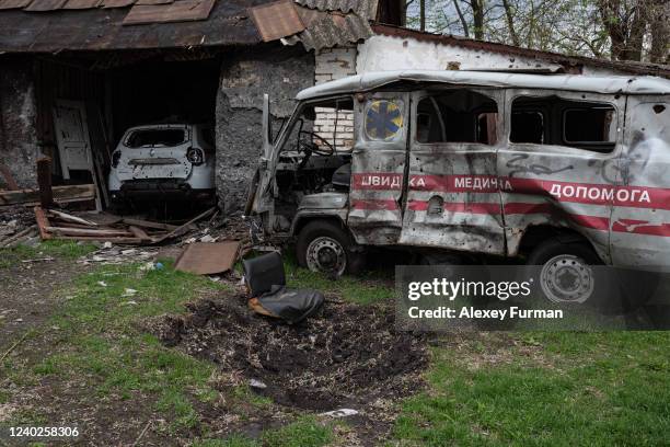 Destroyed ambulances are seen not far from the destroyed hospital building on April 26, 2022 in Novyi Bykiv, Ukraine. The towns around Kyiv are...
