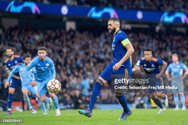Karim Benzema of Real Madrid scoring his 2nd and his teams 3rd goal from the penalty spot during the UEFA Champions League Semi Final Leg One match...