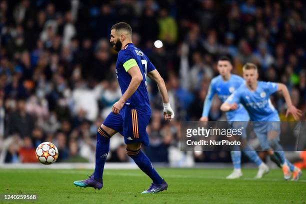 Karim Benzema of Real Madrid shooting to penalty and score his second goal during the UEFA Champions League Semi Final Leg One match between...
