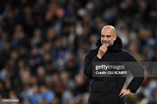 Manchester City's Spanish manager Pep Guardiola reacts during the UEFA Champions League semi-final first leg football match between Manchester City...