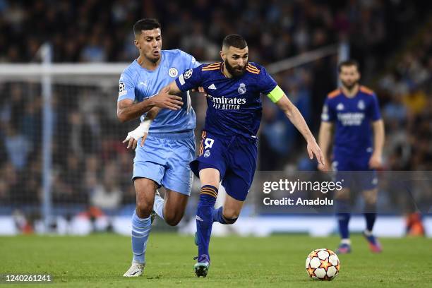 April: Rodri of Manchester City and Karim Benzema of Real Madrid compete for the ball during the UEFA Champions League Semi Final Leg One match...