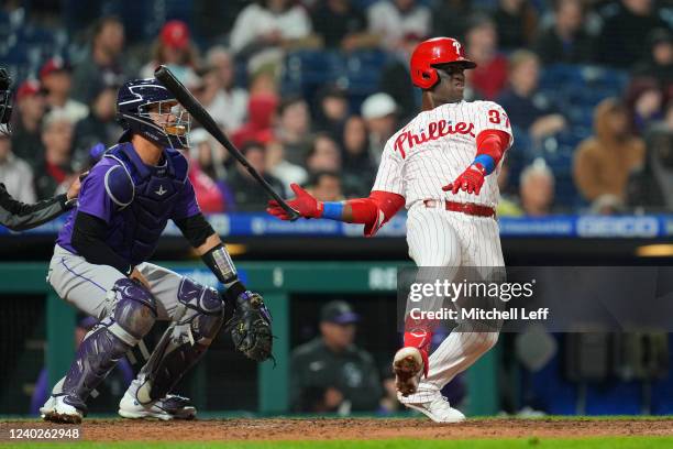 Odubel Herrera of the Philadelphia Phillies hits an RBI double in the bottom of the fourth inning against the Colorado Rockies at Citizens Bank Park...