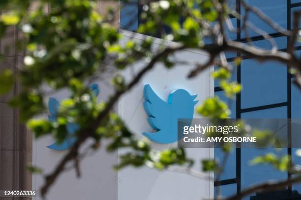 The Twitter logo is seen at their headquarters on April 26, 2022 in downtown San Francisco, California. - Billionaire Elon Musk is capturing a social...
