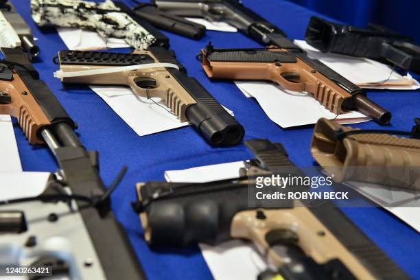 "Ghost guns" seized in federal law enforcement actions are displayed at the Bureau of Alcohol, Tobacco, Firearms, and Explosives field office in...