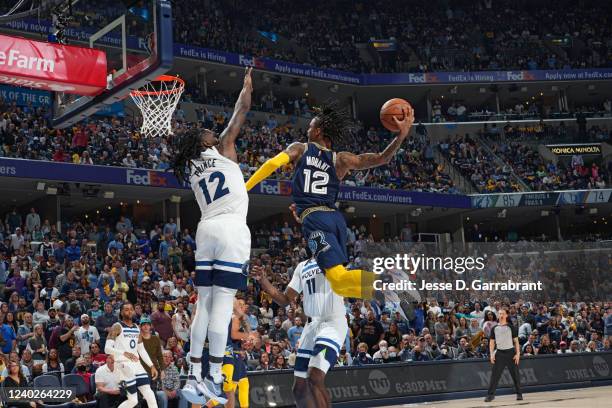 Ja Morant of the Memphis Grizzlies dunks the ball against the Minnesota Timberwolves during Round 1 Game 5 on April 26, 2022 at FedExForum in...