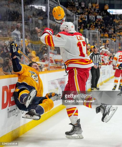 Milan Lucic of the Calgary Flames is called for interference on his hit to Matt Duchene of the Nashville Predators during an NHL game at Bridgestone...