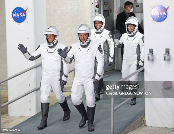 Crew-4 mission astronauts Bob Hines, Kjell Lindgren, Jessica Watkins and Samantha Cristoforetti of the European Space Agency walk out of the Neil A....