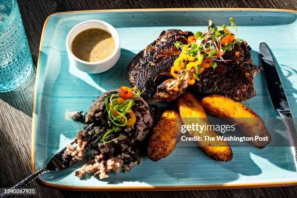 The Jerk Chicken with Rce and Plantains at Mariscos 1133 Restaurant photographed February 23, 2022 in Washington, DC.