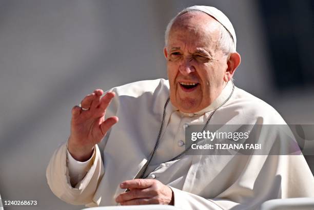 Pope Francis arrives to hold a weekly general audience on Saint Peter's square in the Vatican on April 27, 2022.