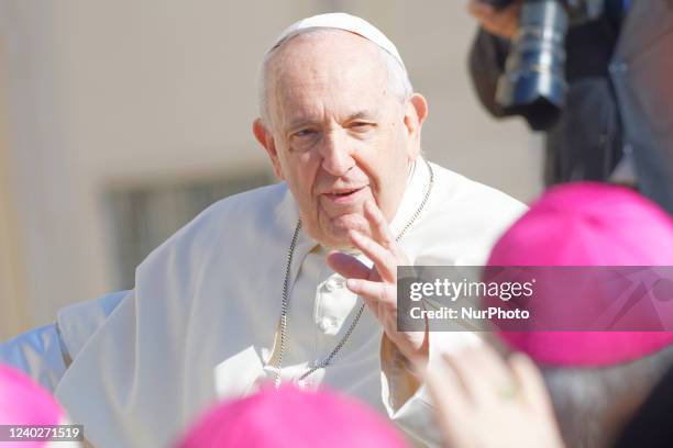 Pope Francis salutes bishops at the end of his weekly general audience in St. Peter's Square, at the Vatican, Wednesday, April 27, 2022.