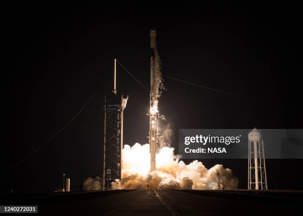 In this handout provided by the National Aeronautics and Space Administration ,A SpaceX Falcon 9 rocket carrying the company's Crew Dragon spacecraft...