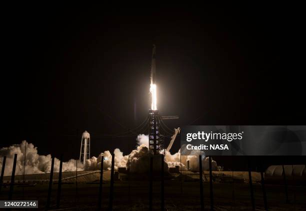 In this handout provided by the National Aeronautics and Space Administration ,A SpaceX Falcon 9 rocket carrying the company's Crew Dragon spacecraft...