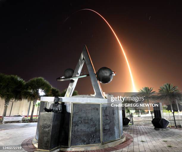 Time exposure shows the arc of the SpaceX Falcon 9 rocket as it streaks toward space after lifting off from the Kennedy Space Center, as viewed from...