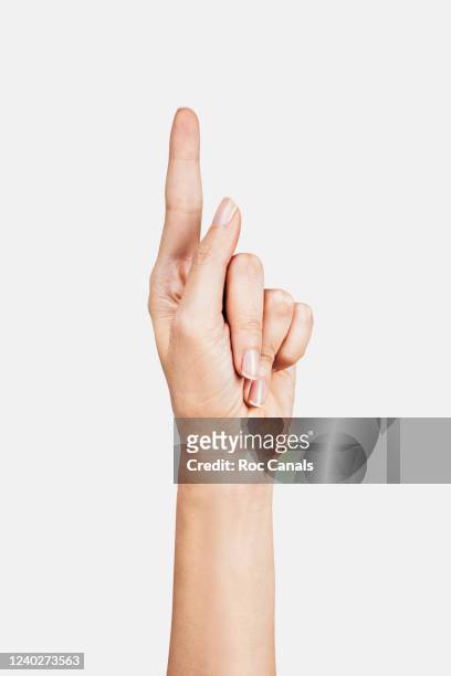 human hand with finger pointing up - zeigefinger stock-fotos und bilder