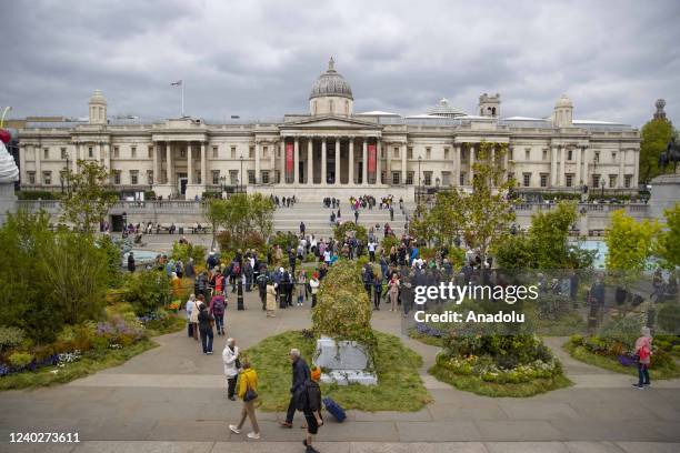 Trafalgar Square covered with green to draw attention to "reducing carbon emissions" and "protecting natural life" in London, United Kingdom on April...