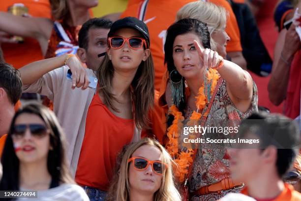 Bouchra van Persie wife of Robin van Persie, Gertrude Kuyt wife of Dirk Kuyt during the World Cup match between Holland v Chile on June 23, 2014