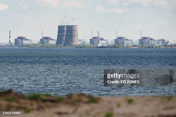 General view shows the Zaporizhzhia nuclear power plant, situated in the Russian-controlled area of Enerhodar, seen from Nikopol in April 27, 2022.