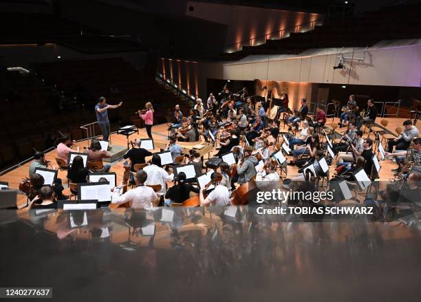 Luigi Gaggero conducts the Kyiv Symphony Orchestra during a rehearsal at the Berlin Philharmonic on April 27, 2022.