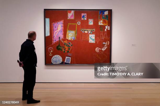 Person looks at Henri Matisse's "The Red Studio" during a press preview on April 27 at the The Museum of Modern Art in New York, as the museum...