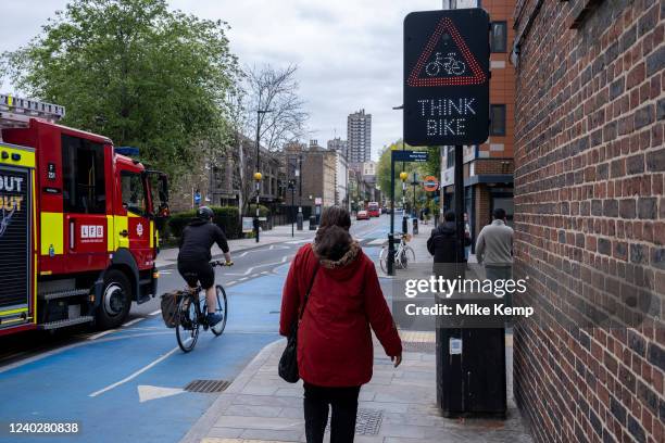 Think Bike sign beside a cycle lane in Shadwell on 27th April 2022 in London, United Kingdom. Cycle Superhighway 3 or CS3 is a long cycle path and...