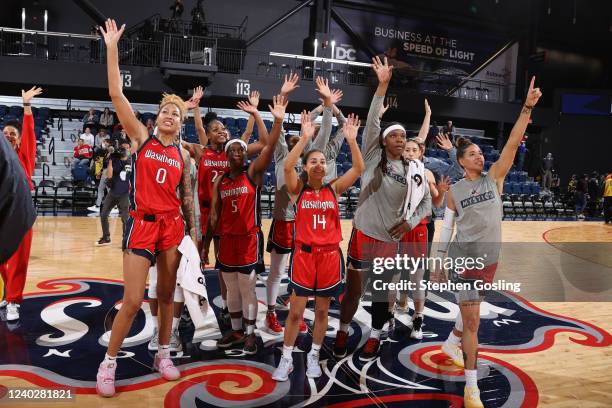 Washington Mystics celebrate after winning a preseason game against the Minnesota Lynx on April 27, 2022 at Entertainment and Sports Arena in...