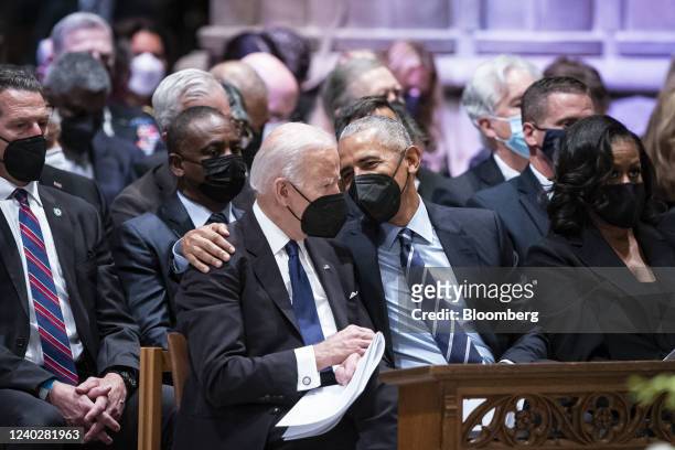 Former U.S. President Barack Obama, center right, embraces U.S. President Joe Biden during the funeral for late Madeleine Albright, former U.S....