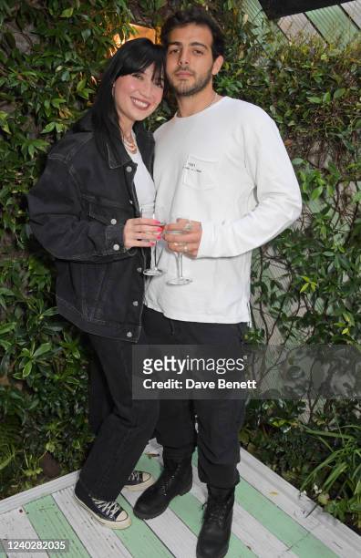 Daisy Lowe and Jordan Saul attend a party to celebrate Quatre Vin launching in Chucs restaurants in time for the summer on April 27, 2022 in London,...