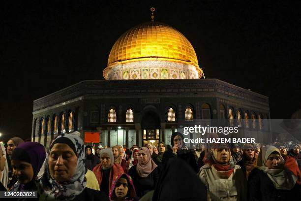 Palestinian devotees pray on Laylat al-Qadr outside the Dome of the Rock in Jerusalem's Al-Aqsa Mosque during the Muslim fasting month of Ramadan on...