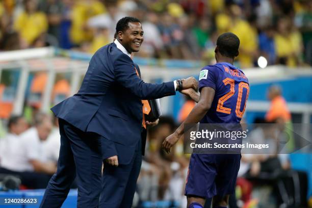 Georginio Wijnaldum of Holland celebrates his goal 0-3 with assistant trainer Patrick Kluivert of Holland during the World Cup match between Holland...