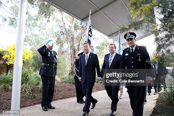 Secretary General Ban Ki-Moon, Attorney-General Robert McClelland and AFP Commissioner Tony Negus arrive at a training compound to witness an...