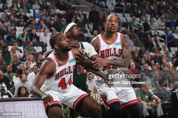 Patrick Williams and DeMar DeRozan of the Chicago Bulls box out Bobby Portis of the Milwaukee Bucks during Round 1 Game 5 of the 2022 NBA Playoffs on...