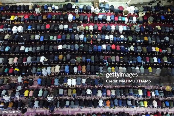 Palestinian devotees pray during Laylat al-Qadr during the Islamic holy month of Ramadan at Sayed al-Hashim Mosque in Gaza City, early on April 28,...