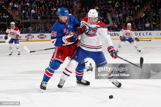 Braden Schneider of the New York Rangers skates against Nick Suzuki of the Montreal Canadiens at Madison Square Garden on April 27, 2022 in New York...