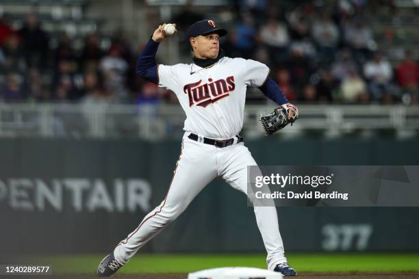 Gio Urshela of the Minnesota Twins throws the ball to first base to get out Javier Baez of the Detroit Tigers in the seventh inning of the game at...